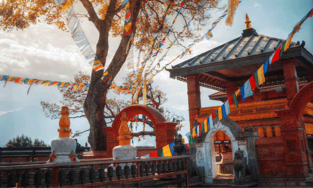 monastery with a red sky background, player flags and tree